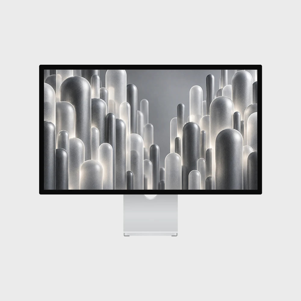 A sleek all-in-one desktop computer with a thin black bezel and stand, displaying a modern abstract wallpaper of metallic cylindrical shapes, set against a solid light gray background.